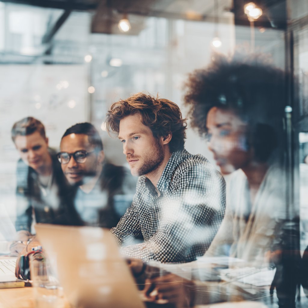 A small, diverse team working together